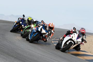 racing motorcycles in curve