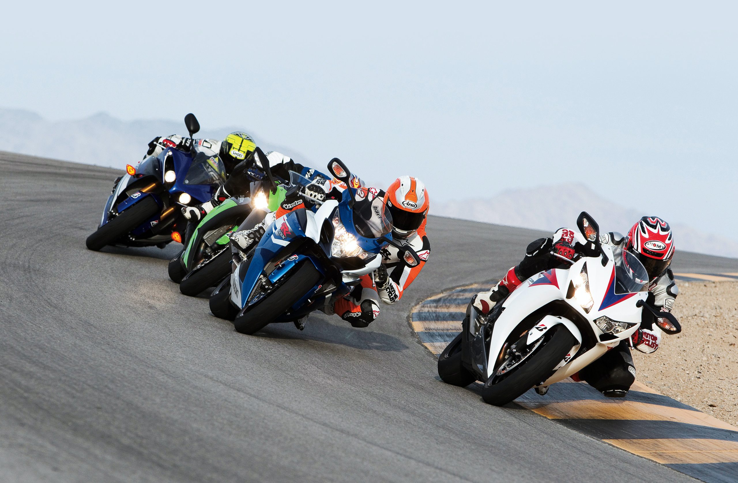 racing motorcycles in curve